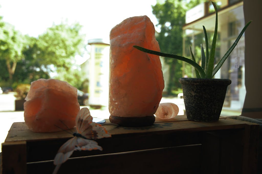 salt lamp and plant placing in the open window
